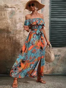Detailed view of women's tropical print off-shoulder maxi dress with waist tie.