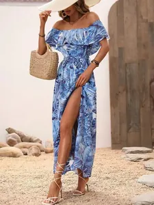 Detailed view of a blue tropical print off-shoulder ruffle maxi dress with a side slit.
