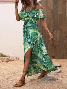 Full-length view of a green tropical monstera leaf print off-shoulder maxi dress