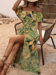 Detailed view of off-shoulder tropical print dress with ruffled hem and waist tie
