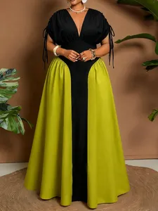 Detailed view of elegant plus size V-neck maxi dress with lime green color block panels
