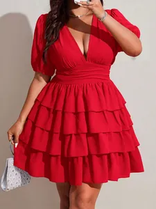 Detail view of a vibrant red plus size V-neck tiered mini dress
