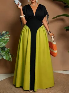 Detail view of a women's plus size V-neck color-block maxi dress with cinched waist