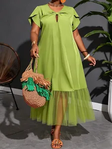 Plus size lime green midi dress featuring elegant mesh splicing and v-neck detail.