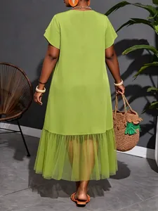 Back view of a vibrant lime green plus size midi dress featuring a mesh ruffled hem