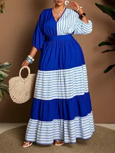 Close-up showing the blue and white striped color-block V-neck maxi dress details.