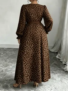 Rear view of a long-sleeved leopard print maxi dress with elegant brown belt detail.