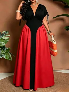 Detailed view of the V-neck patchwork design and drawstring sleeve accents on the dress.