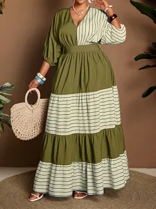 Elegant olive green tiered maxi dress featuring a V-neck and stylish striped pattern