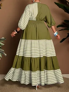 Back view of a stylish tiered olive green and white striped maxi dress with half sleeves.