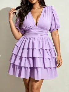 Close-up detail of a plus size V-neck tiered mini dress in elegant lavender purple