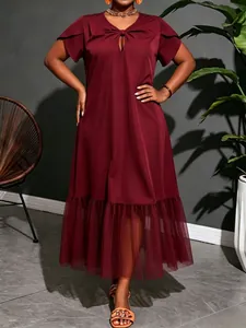 Elegant burgundy midi dress featuring mesh hem splicing and cutout neckline detail