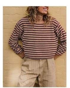 Close-up of a stylish striped knit sweater with earthy brown and beige tones.
