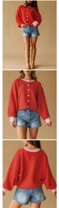 Gedetailleerde weergave van het rode oversized gebreide vest met roze bies