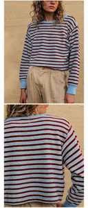 Detailed view of women's loose round neck striped knit sweater with blue and brown hues