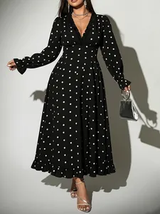 Elegant black V-neck polka dot midi dress with long sleeves and ruffled details