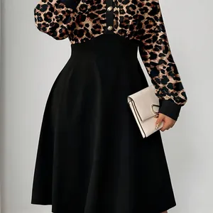 Elegant leopard print polo neck midi dress with high waist black skirt detail.