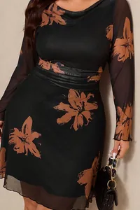 Close-up of elegant floral print and fabric texture on a black plus size midi dress