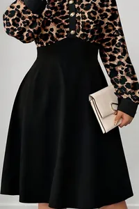 Close-up of elegant leopard print midi dress with polo collar and black high-waist skirt