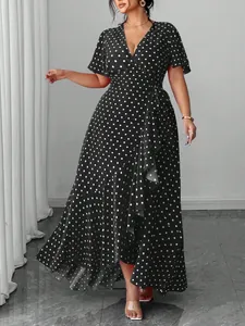 Elegant plus size black polka dot wrap maxi dress with V-neck and ruffled hem detail