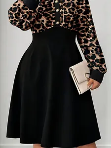 Elegant leopard print midi dress with polo collar and black A-line skirt layout.
