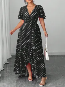 Elegant black and white polka dot wrap midi dress with V-neck and stylish ruffles