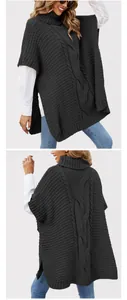 Detail of a charcoal chunky cable knit poncho with a cozy turtleneck and loose fit