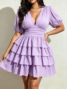 Detail view of a lavender V-neck mini dress with elegant tiered ruffled skirt layers