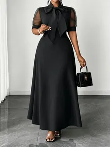 Elegant black midi dress with mesh sleeves and large bow-knot collar detail