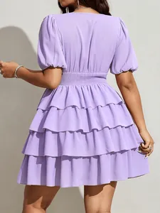 Detailed back view of a lavender purple short sleeve tiered ruffle mini cake dress.