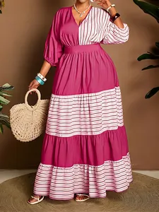 Close-up of plus size V-neck striped contrast maxi dress with tiered skirt detail