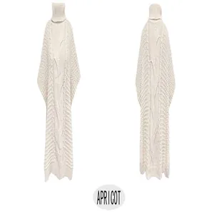 Detailed view of apricot turtleneck cable knit poncho sweater vest showing texture