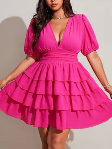 Detailed view of a plus size V-neck tiered ruffled pink mini dress for summer fashion.