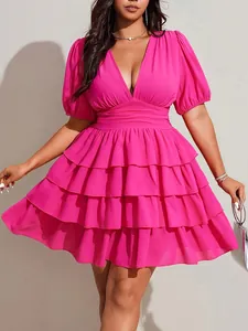 Close-up detail of plus size hot pink V-neck short sleeve tiered ruffle mini cake dress