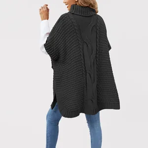 Back view of a charcoal grey turtleneck cable-knit poncho sweater vest for women