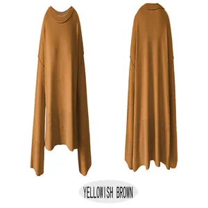 Front and back detail of a yellowish brown oversized knit sweater with flare sleeves