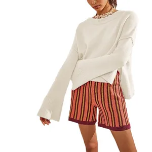 Women's chic white crew neck knit sweater featuring stylish oversized bell sleeves