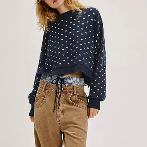 Navy round neck knit sweater with white butterfly jacquard and cropped loose fit