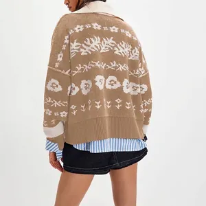 Women's oversized knit cardigan in brown with white floral pattern and jacquard detail.