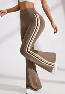 Detailed side view of high-waisted brown flared yoga pants with decorative triple stripes