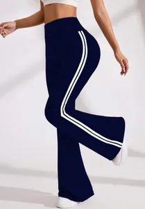Macro detail view of navy blue high-waisted flared yoga pants with white side stripes
