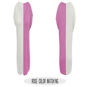 Detailed view of loose V-neck sleeveless knitwear in rose and white color block