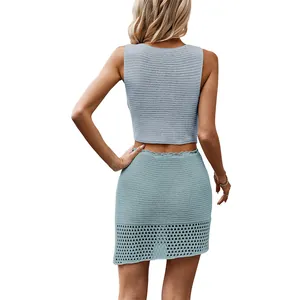 Elegant back view of women's two-piece light blue crochet tank top and mini skirt outfit
