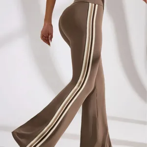 High-waist brown flared yoga pants with stylish side stripes for fitness and Pilates