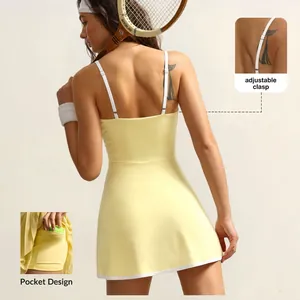 Detailed view of yellow tennis dress featuring adjustable straps and a side ball pocket