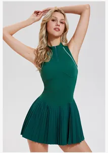 Detail view of a women's dark green half-zip sleeveless tennis dress with pleated skirt