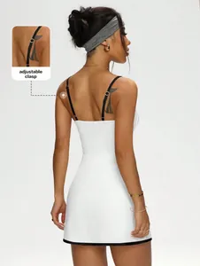 Back view of a white tennis dress featuring black contrast straps with an adjustable clasp detail