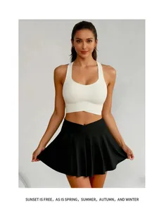 Women's black high-waisted tennis skirt with white criss-cross sports bra athletic set