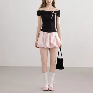 Elegant full body view of black off-shoulder knit top and pink bubble skirt summer set