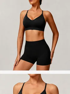 Front view of black seamless knitted yoga bra and high waist shorts set.